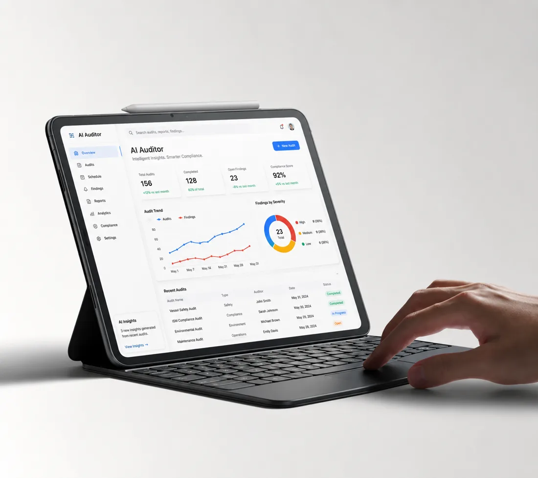 AI Auditor dashboard open on a tablet with keyboard