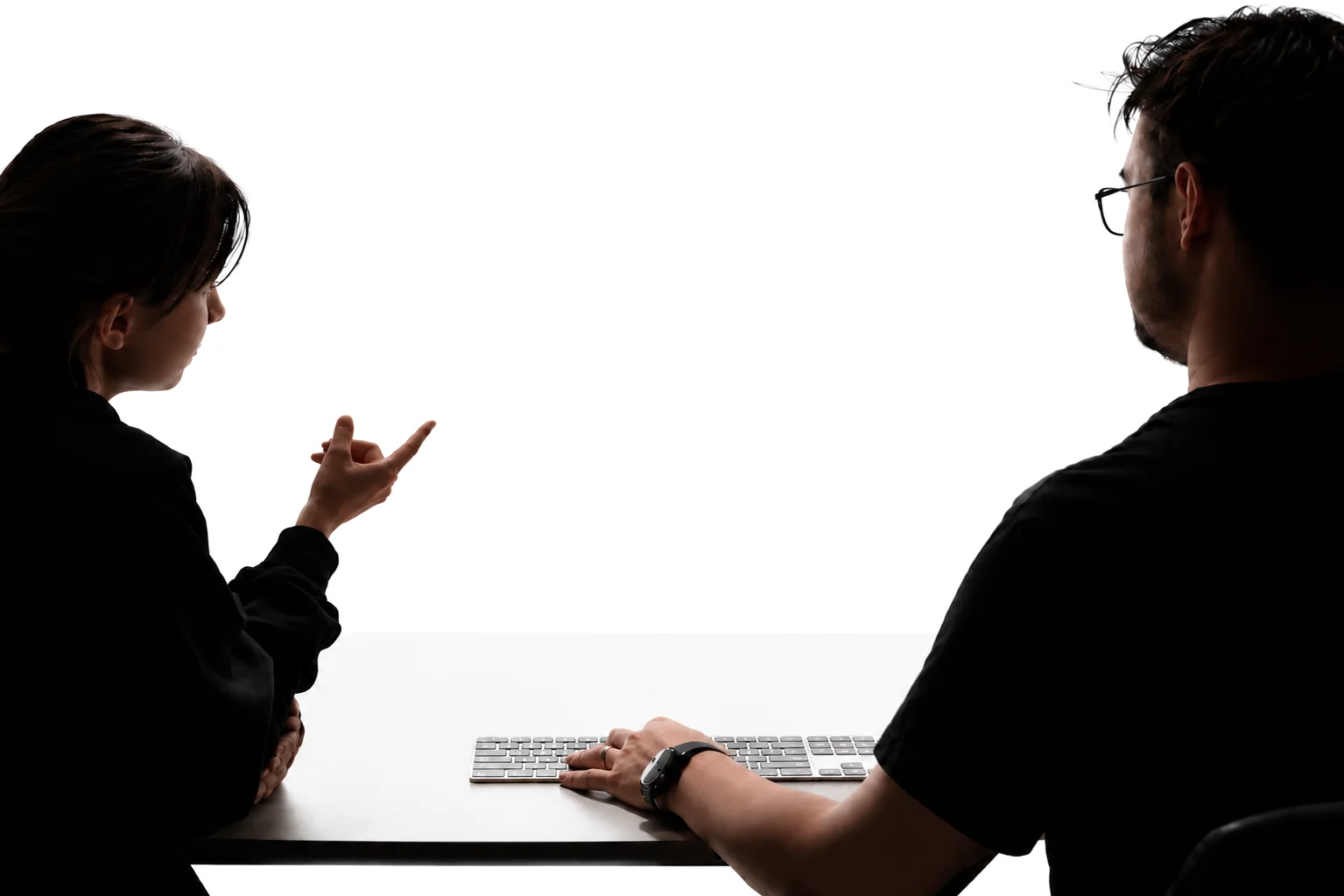 Two fleet operators at a desk, reviewing the FleetRabbit AI command screen together