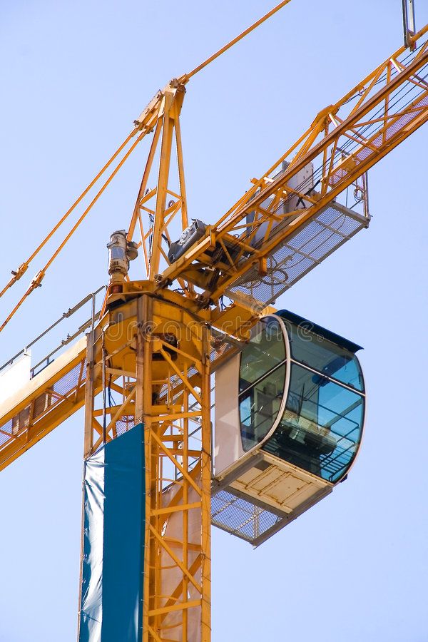 Tower crane cabin against a blue sky